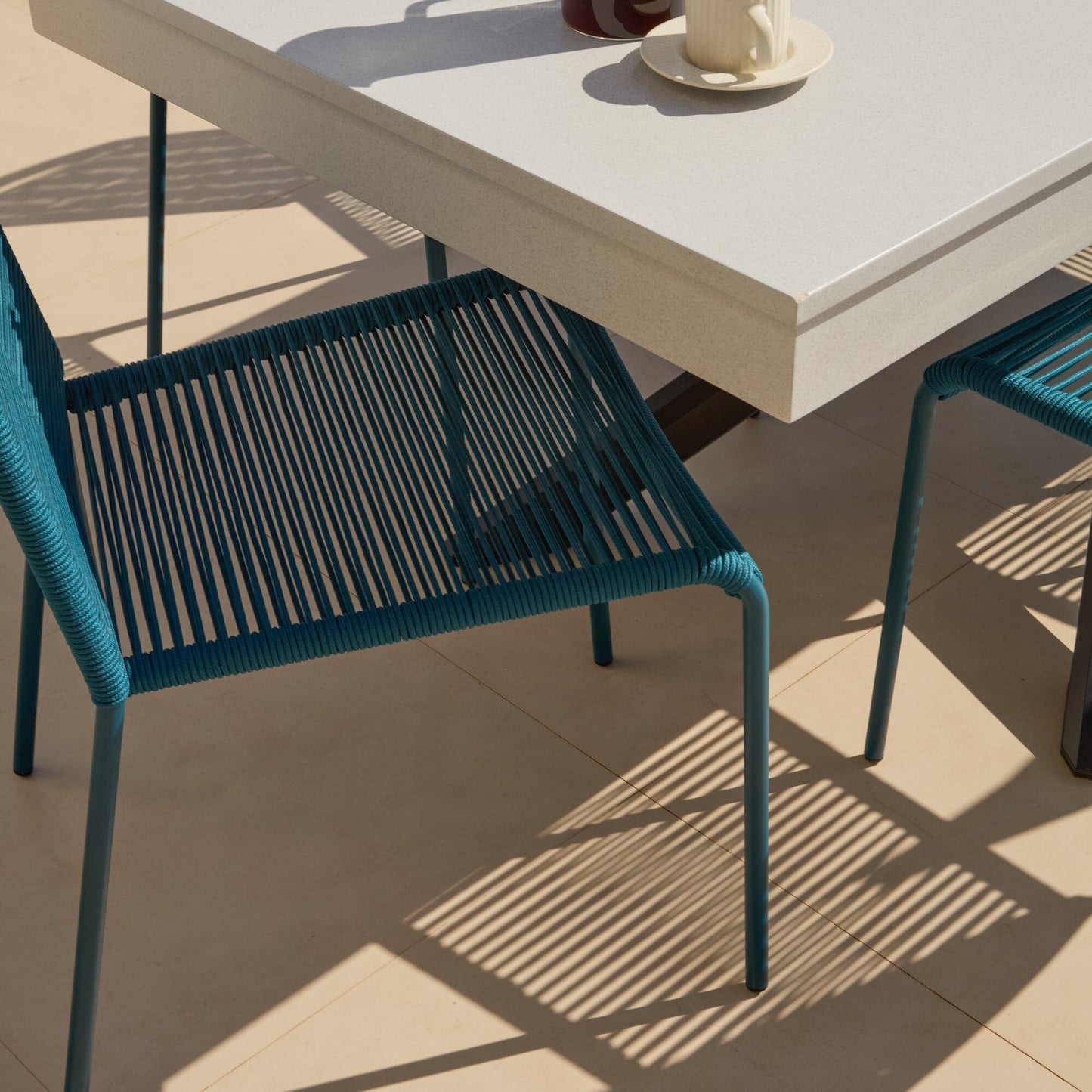 Amelia 6 Seater Pale Grey Concrete Garden Dining Set with Ryder Teal Chairs - Laura James