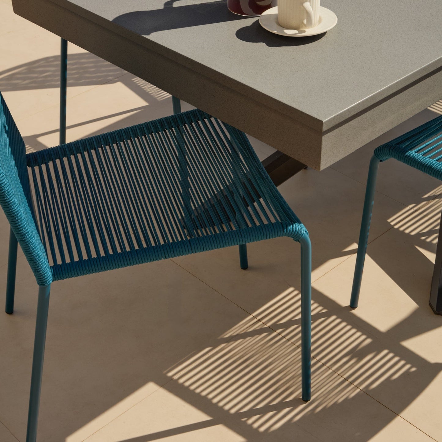 Amelia 6 Seater Dove Grey Concrete Garden Dining Set with Ryder Teal Chairs - Laura James
