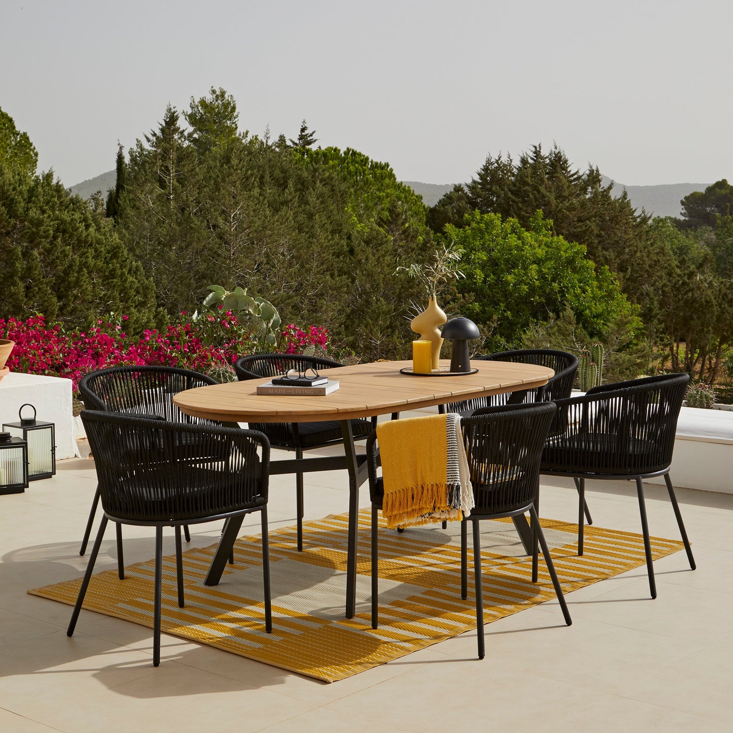 Ezra 6 Seater Oval Wooden Garden Dining Set with 6 Hali Black Rope Chairs - Laura James