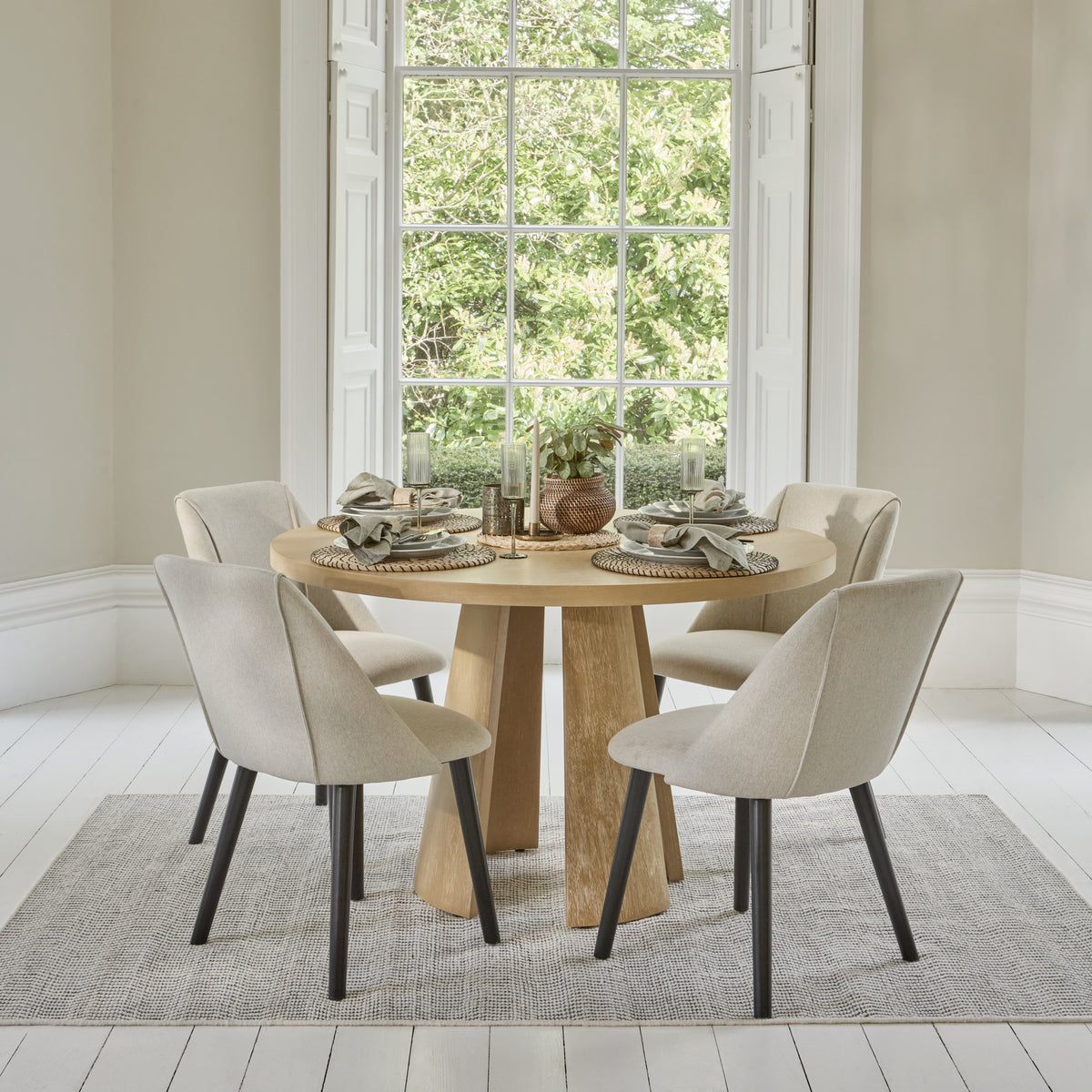 Farren 120cm Whitewash Oak Round Dining Table Set - 4 Seater - Freya Sand Dining Chairs with Black Legs - Laura James
