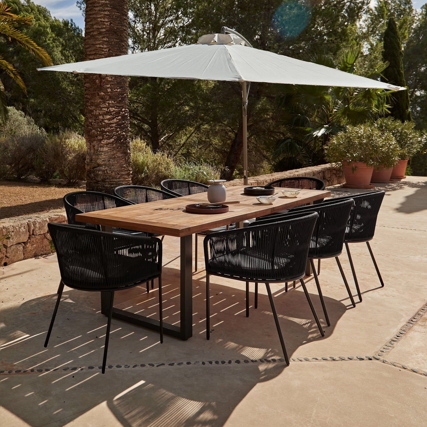 Hali 8 Seater Wooden Outdoor Dining Set with Hali Black Chairs & Cream Lean Over Parasol - 235cm - Laura James