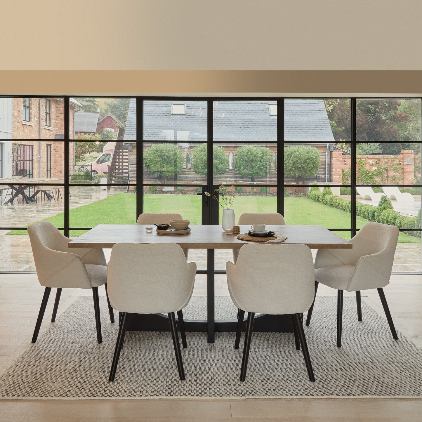 Jade Mango Wood Rectangular Acacia Dining Table Set - 6 Seater - Freya Boucle Armchairs with Black Legs - Laura James