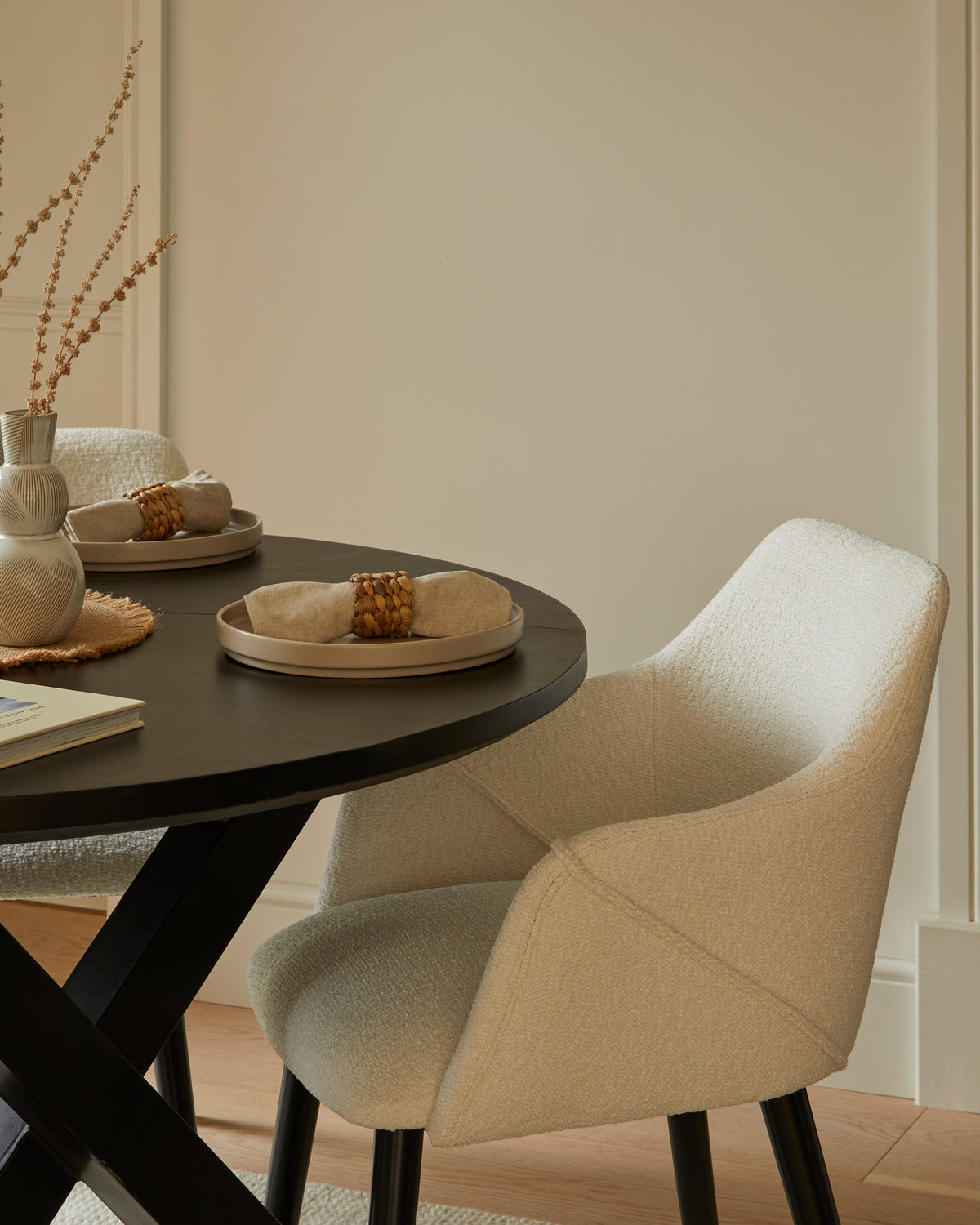 Levi Black Round Dining Table Set - 4 Seater - Freya Boucle Armchairs with Black Legs