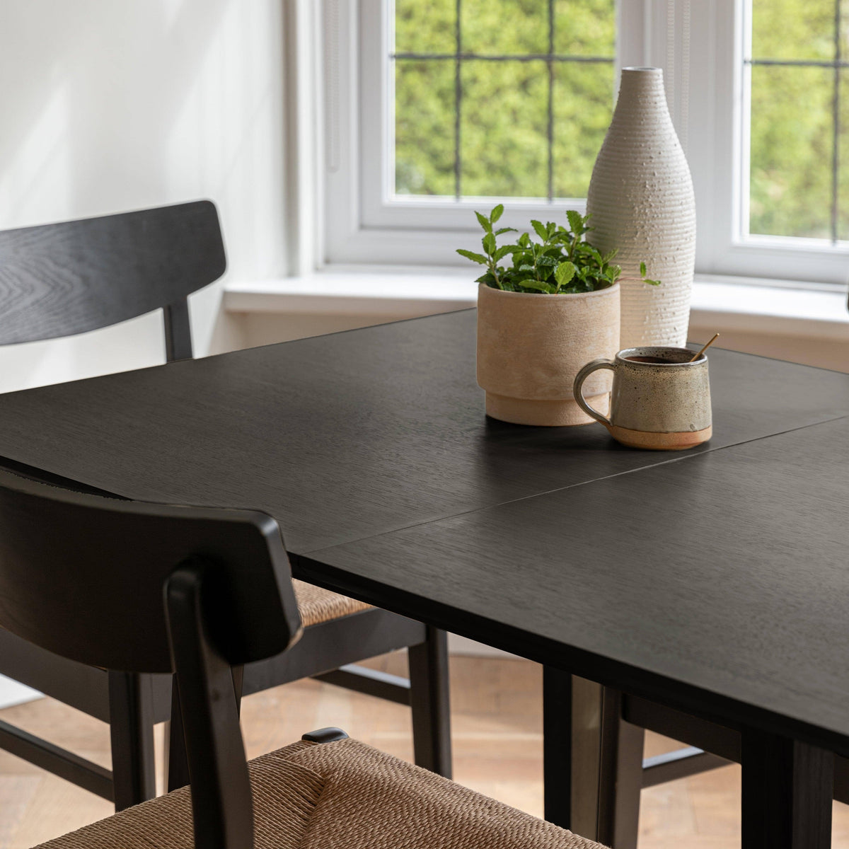 Charlie Black Extendable Dining Table Set - 4 Seater - Faye Woven Black Dining Chairs - Laura James