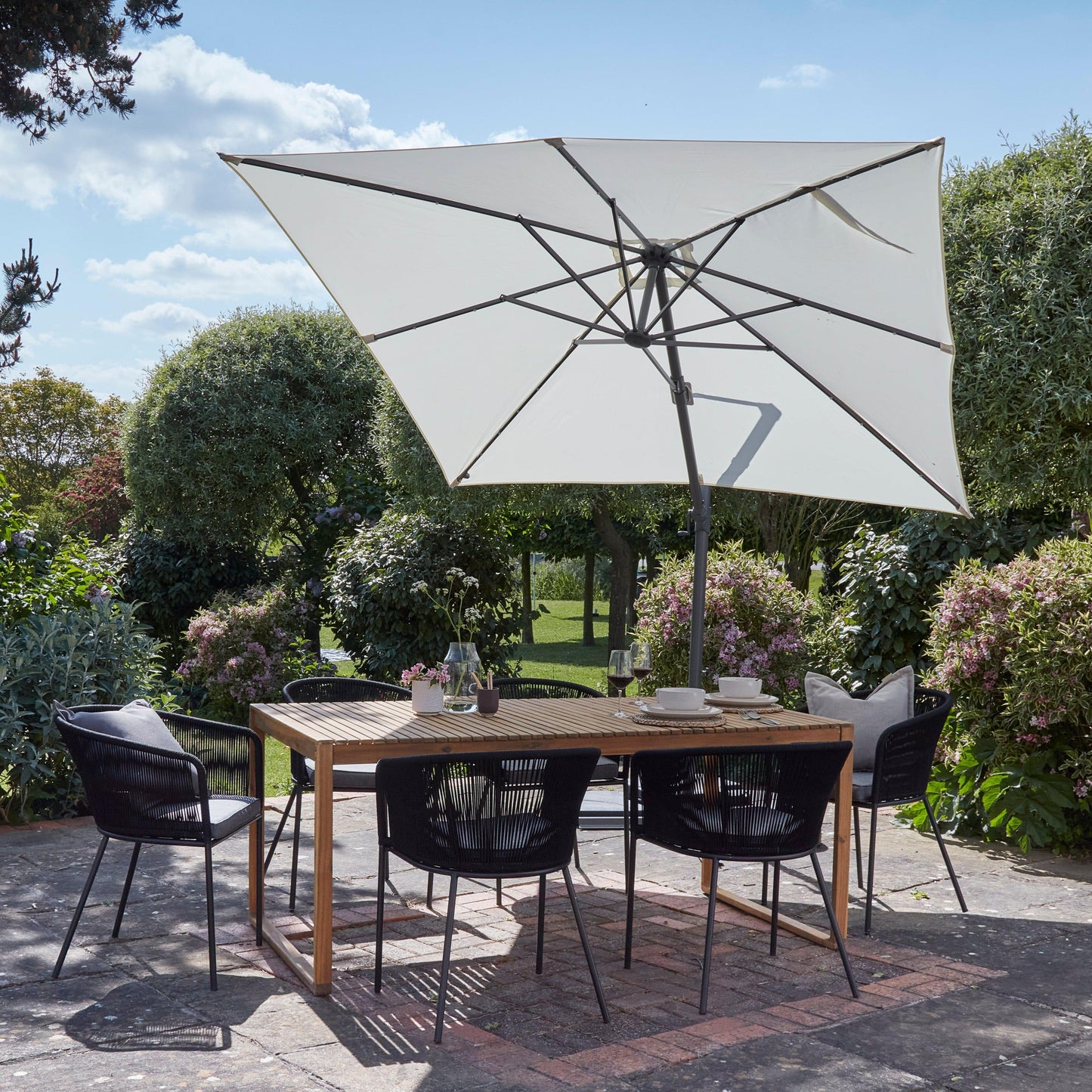 Lennox Table With 6 Hali Black Dining Chairs and Cream Premium LED Parasol