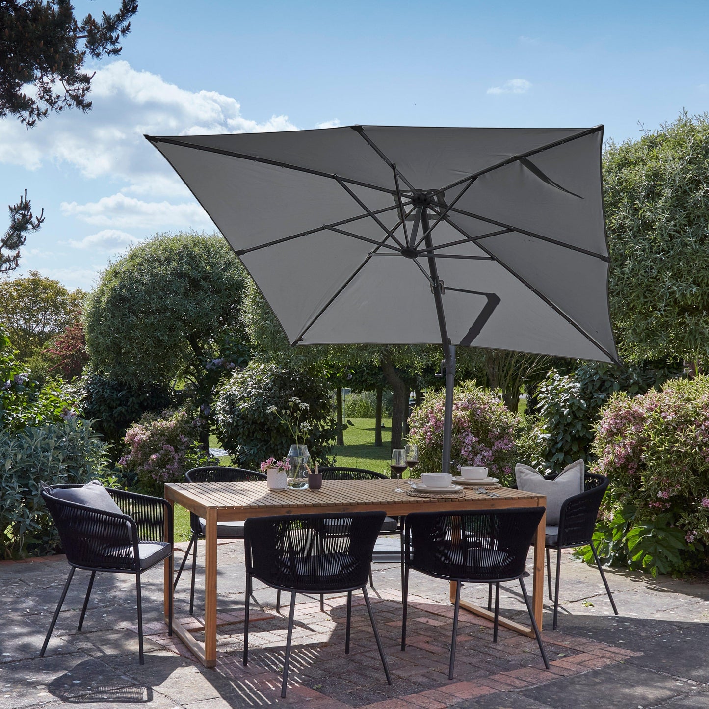 Lennox Table With 6 Hali Black Dining Chairs and Grey Premium LED Parasol