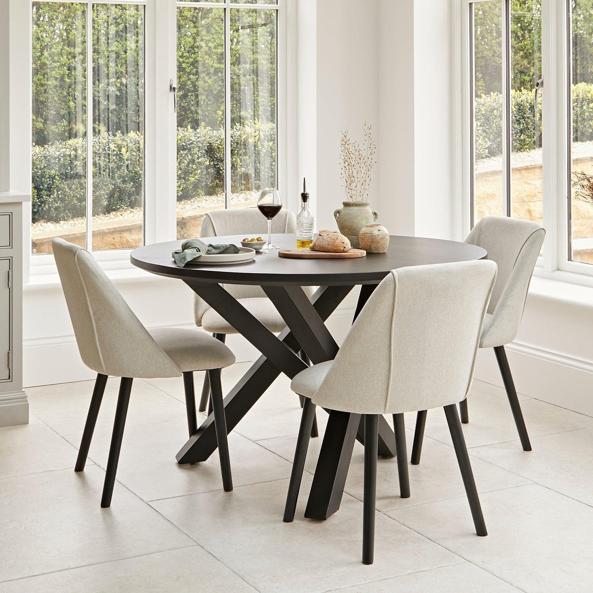 Levi Black Round Dining Table Set - 4 Seater - Sand Dining Chairs with Black Legs - Laura James