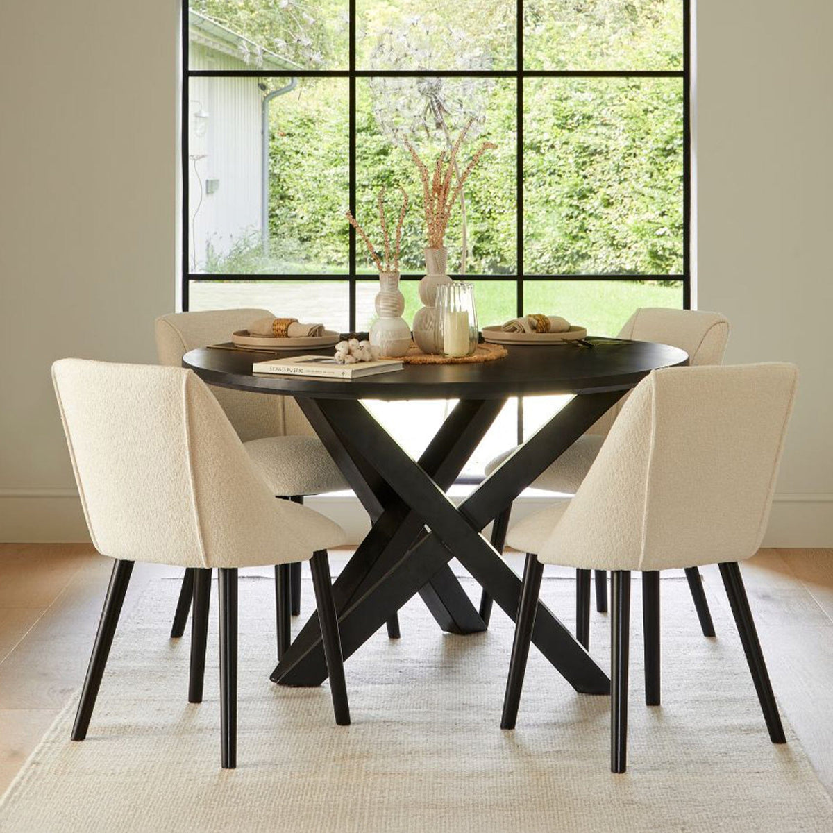 Levi Black Round Dining Table Set - 4 Seater - Freya Boucle Dining Chairs with Black Legs - Laura James
