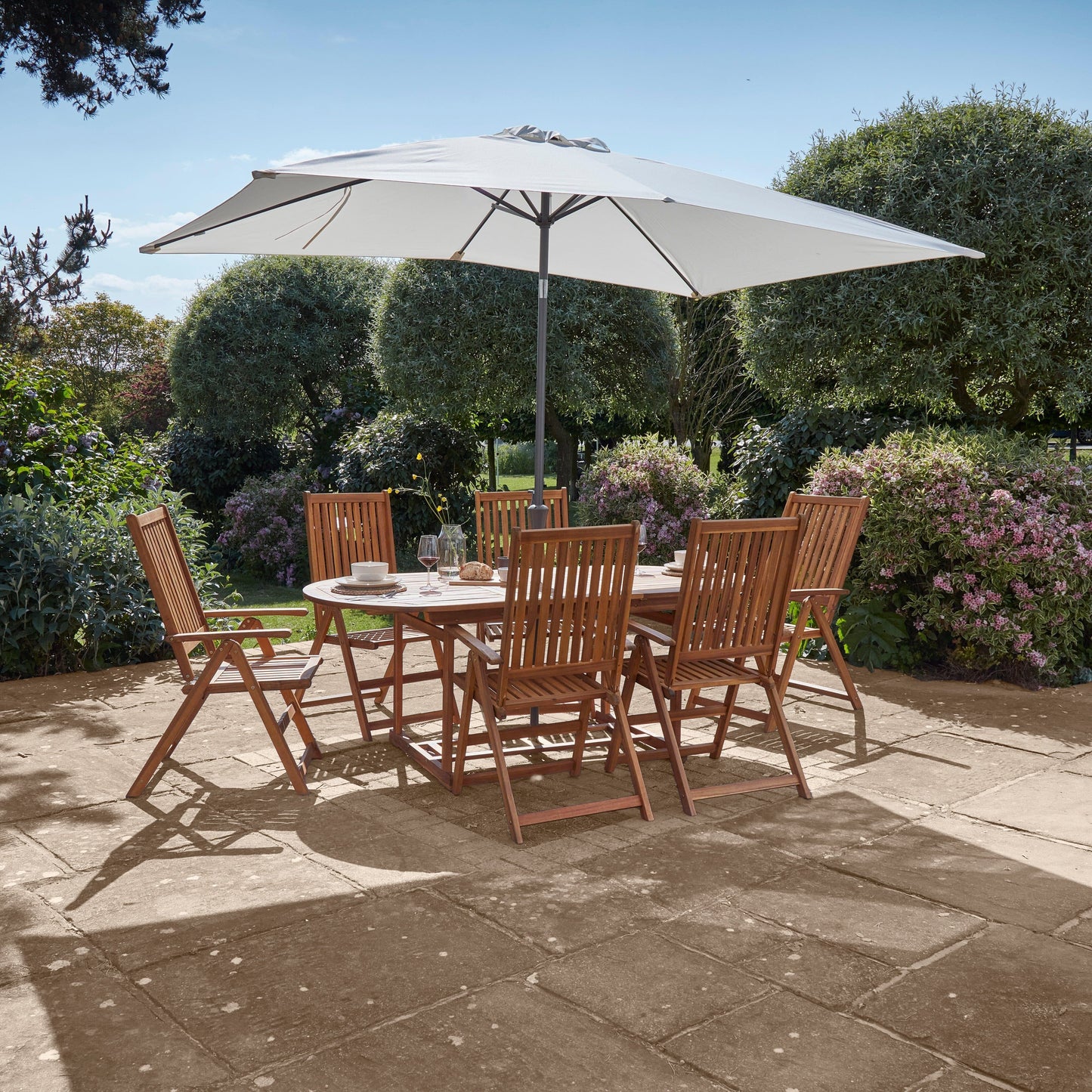Oakley 6 Seater Wooden Extendable Garden Dining Set with Cream LED Premium Parasol - Laura James