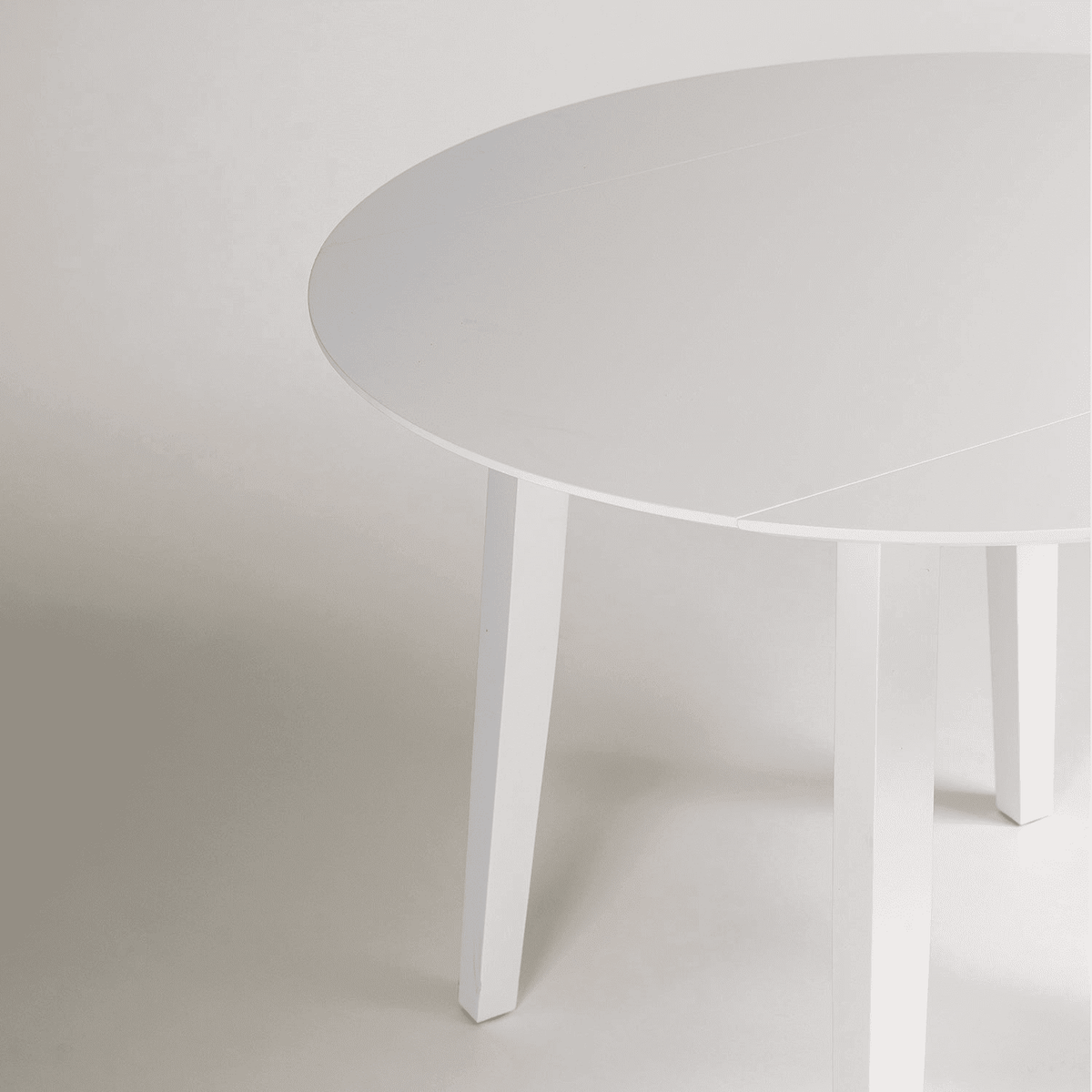 Charlie White Round dining table - with drop leaf