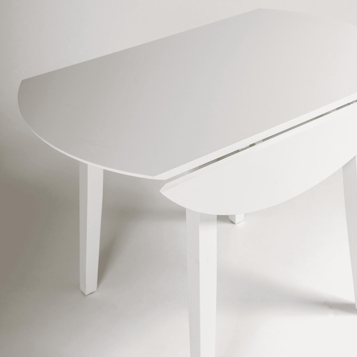 Charlie White Round dining table - with drop leaf