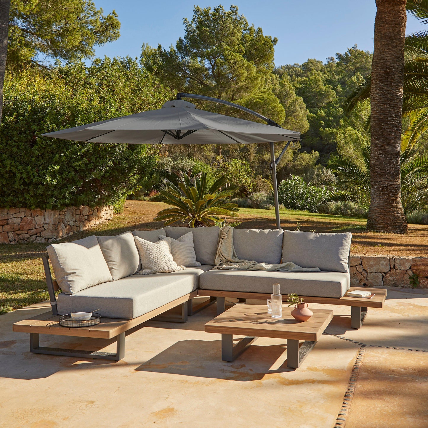 Shiva Stone Garden Corner Sofa Set with Grey Lean Over Parasol - Laura James