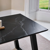 Atlas Black Marble Dining Table - Black Metal Legs - Laura James