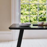 Atlas Black Marble Dining Table - Black Metal Legs - Laura James