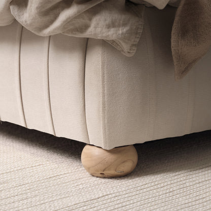 Elodie King Ottoman Bed - Ivory Pleated with Nordic Oak Legs - Laura James 