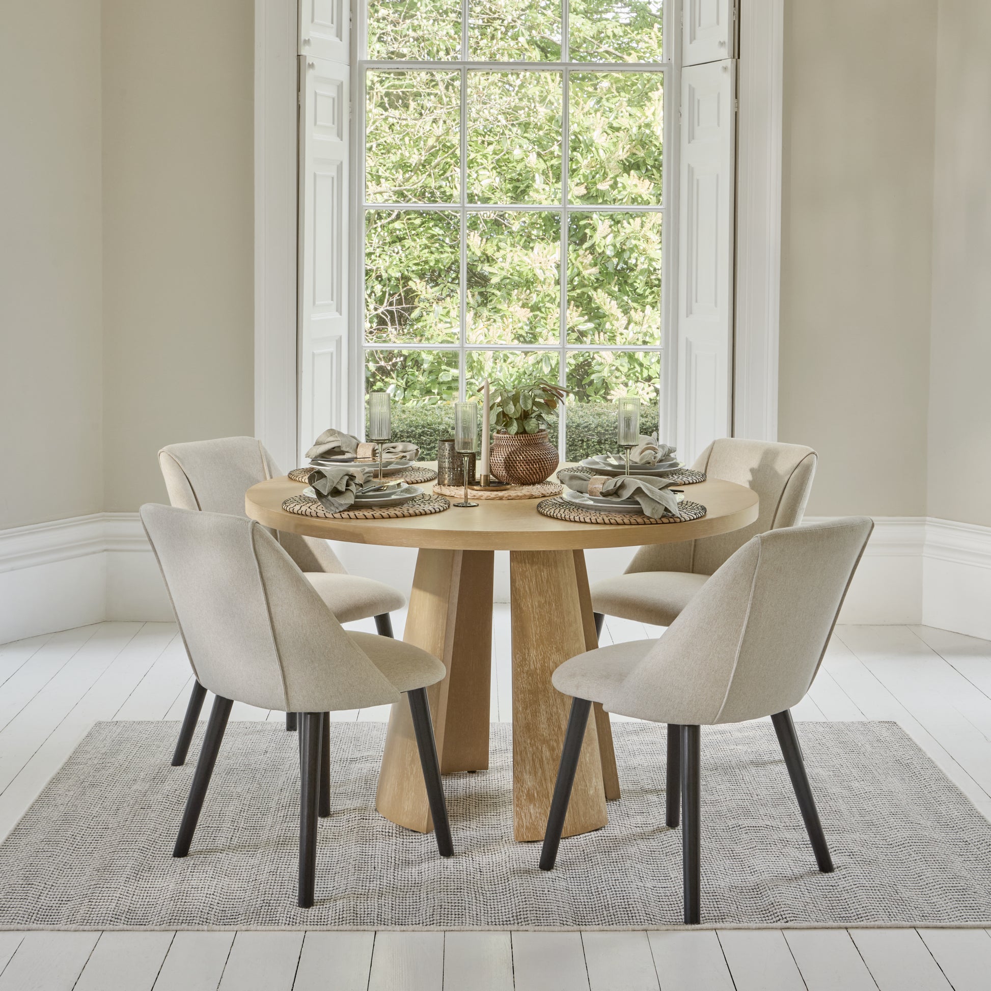 Farren 120cm Whitewash Oak Round Dining Table Set - 4 Seater - Freya Sand Dining Chairs with Black Legs - Laura James