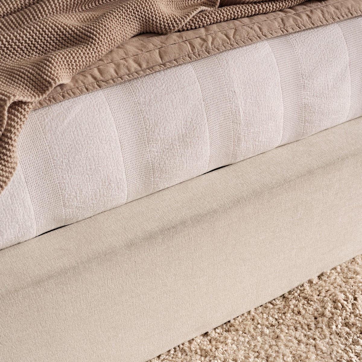 Torin King Ottoman Bed - Ivory with Jet Black Piping - Laura James 