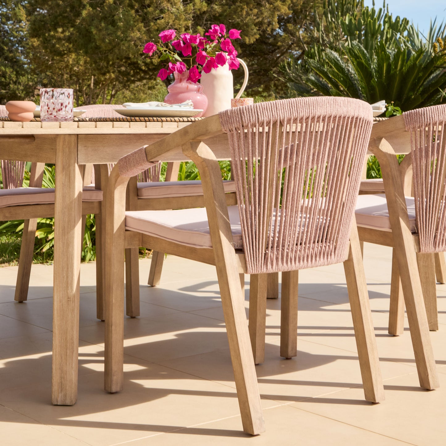 Saffron 6 Seater Extending Wooden Garden Dining Set with Shiro Pink Rope Chairs - Laura James