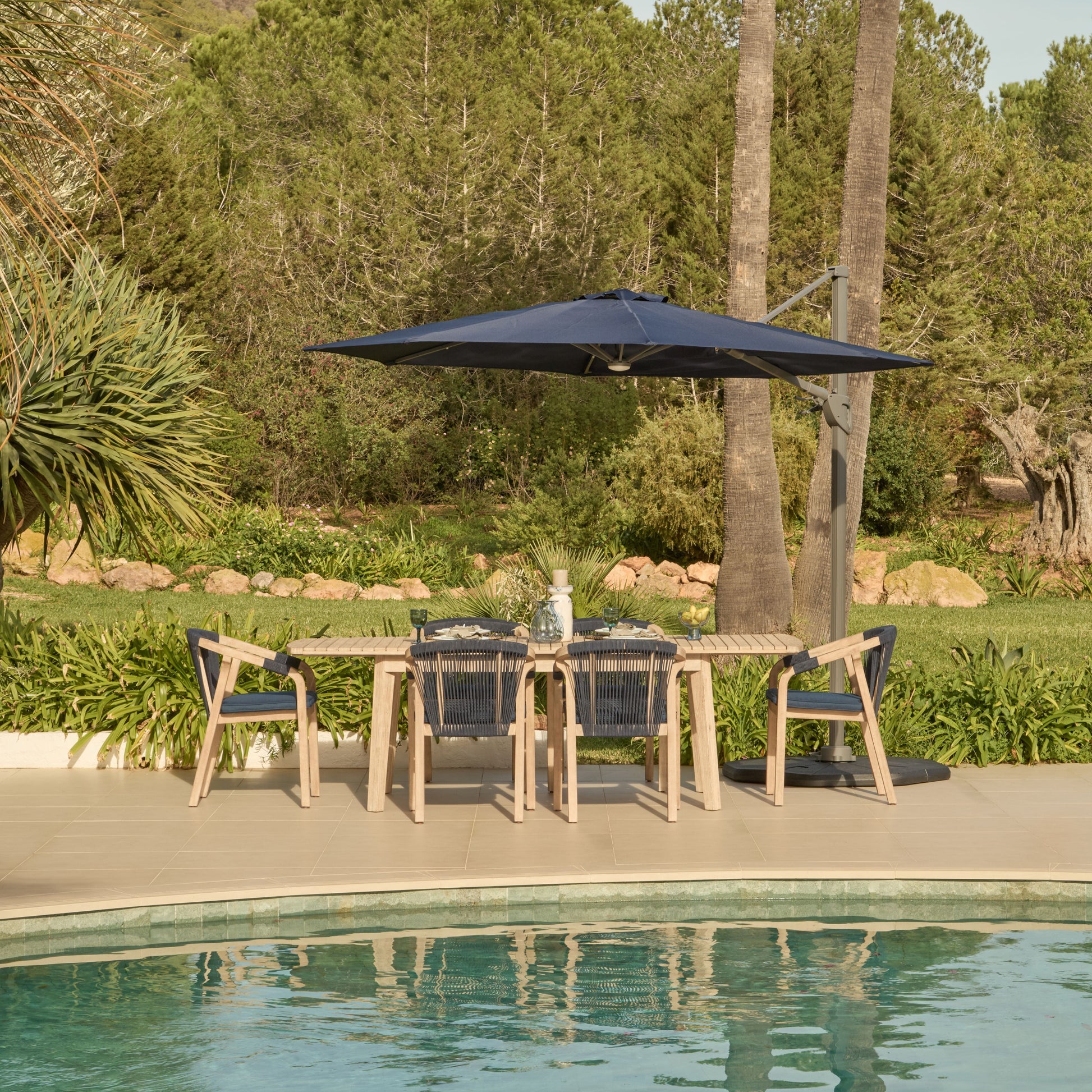 Saffron 6 Seater Extending Wooden Garden Dining Set with Shiro Navy Rope Chairs - Laura James