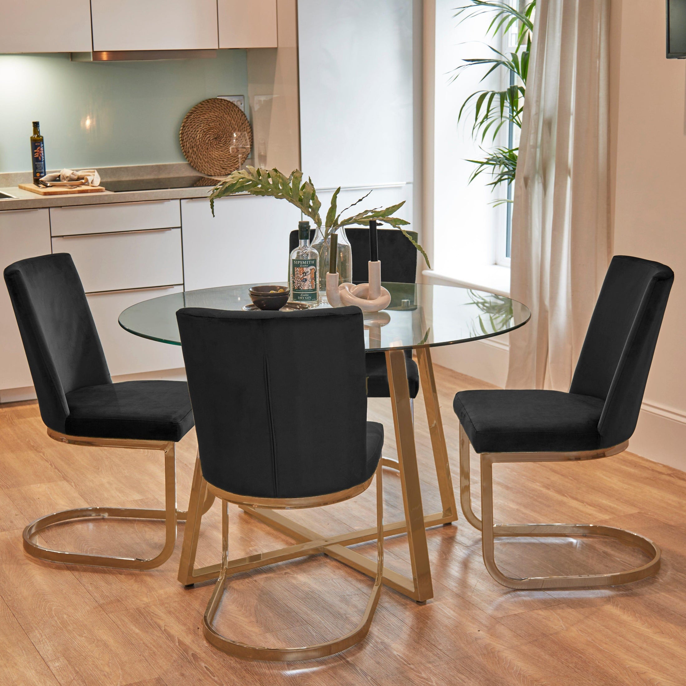 Clara 4 Seater Glass Dining Set with Black Dining Chairs - Laura James