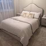 Odette Double Ottoman Bed - Ivory - Jet Black Piping - Laura James 