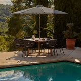 Shiro 6 seater wooden garden dining table with 6 hali black rope chairs and grey parasol - Laura James