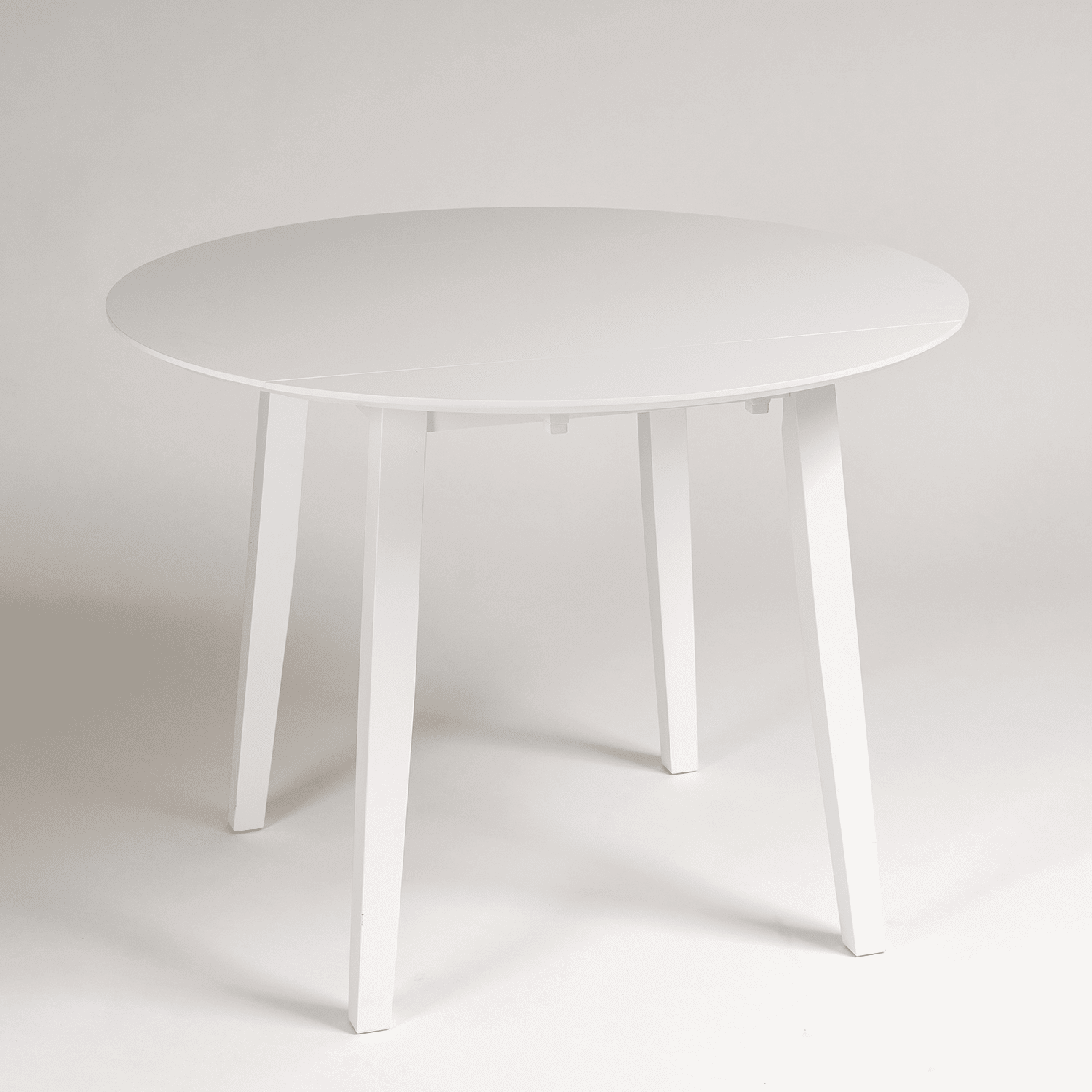 Charlie White Round dining table - with drop leaf - Laura James