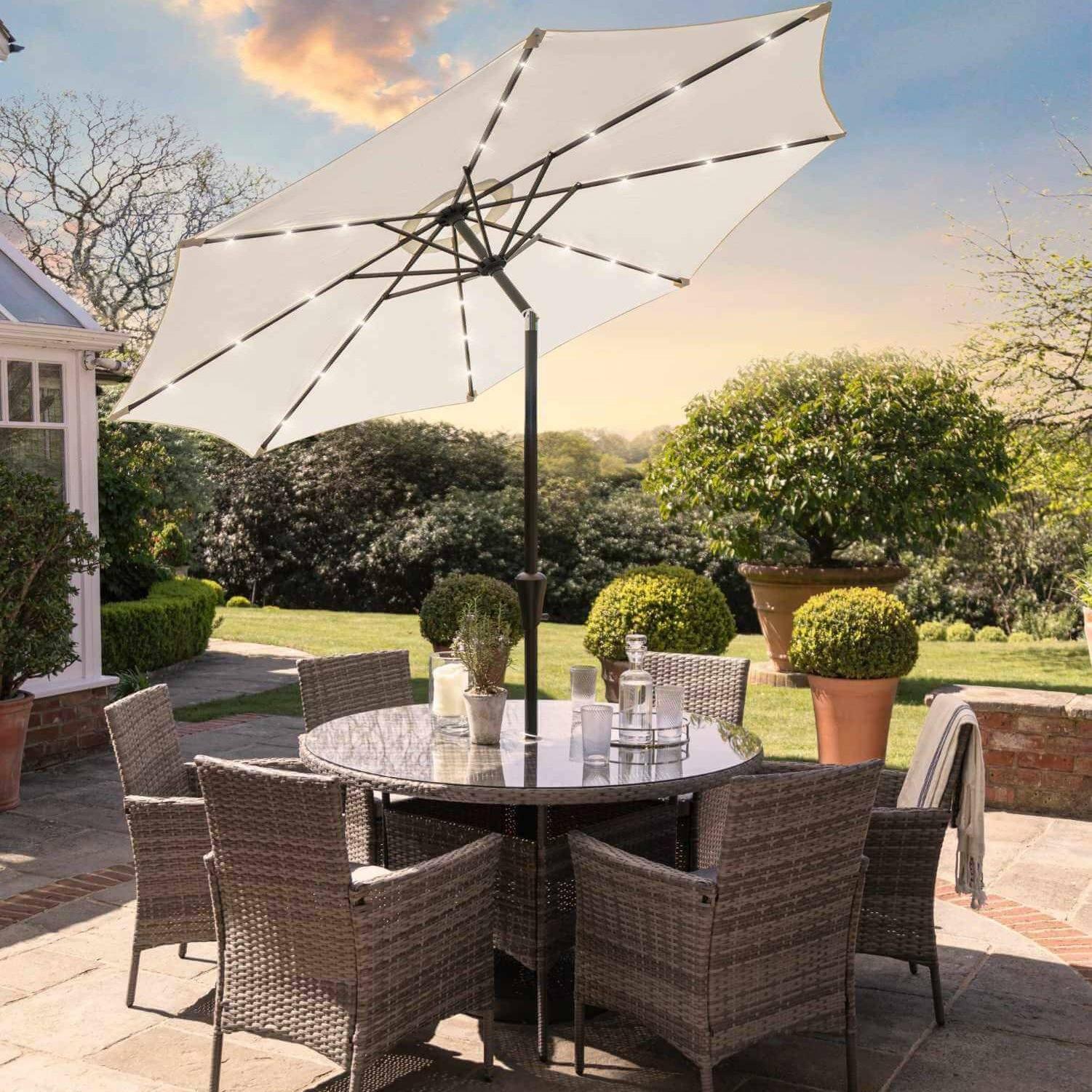 Kemble 6 Seater Rattan Round Dining Set Cream LED Premium Parasol & Parasol Rain Cover