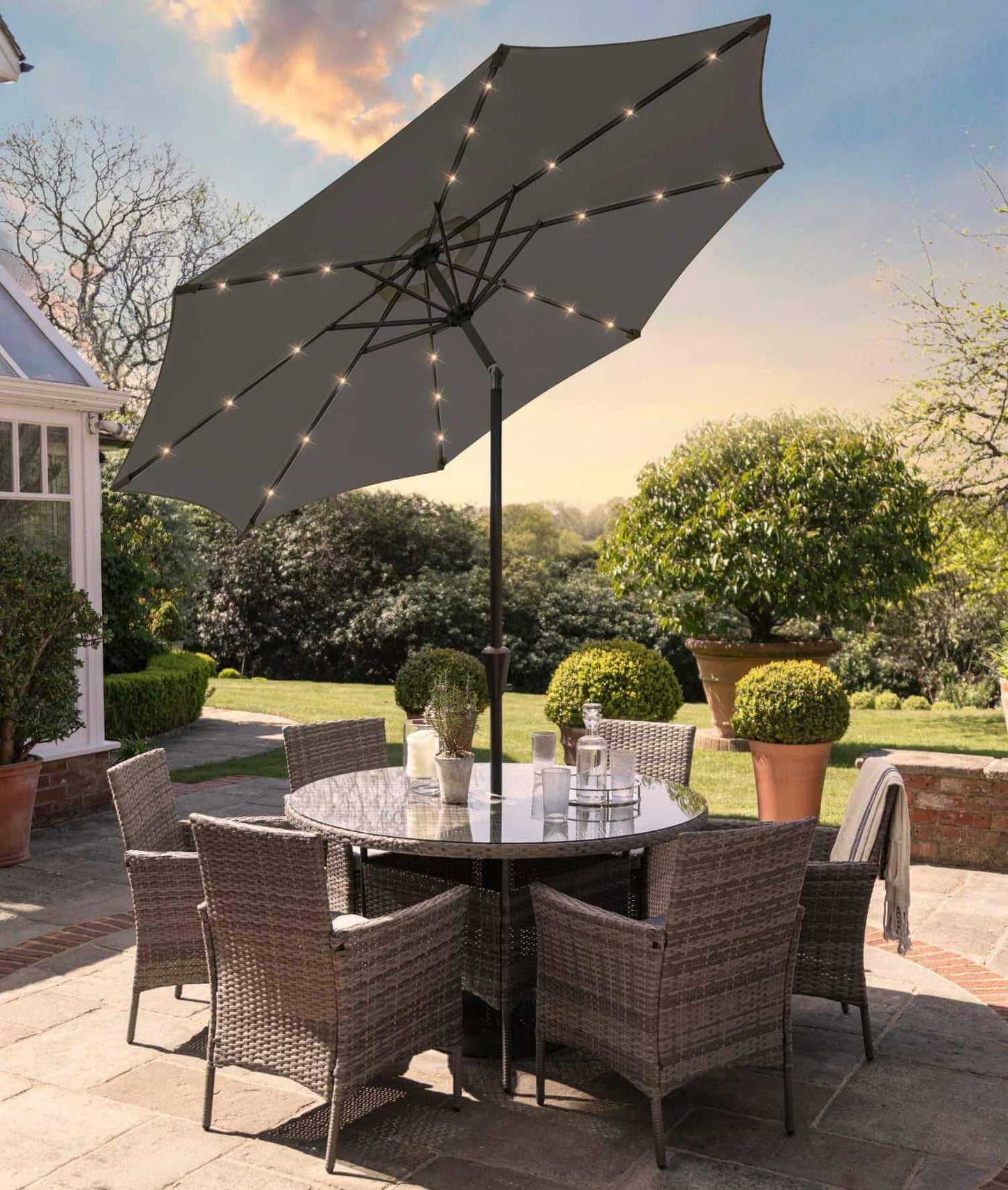 Kemble 6 Seater Rattan Round Dining Set with LED Premium Parasol and Parasol Rain Cover - Grey - Laura James